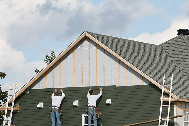 Professional Storm Damage Siding Repair technician working in Chesapeake Beach, MD